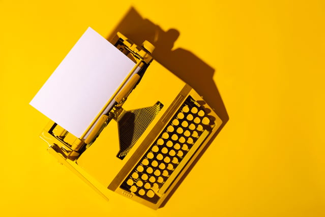 yellow-bright-typewriter-on-a-yellow-symbol-for-w-2021-08-30-19-37-20-utc-min
